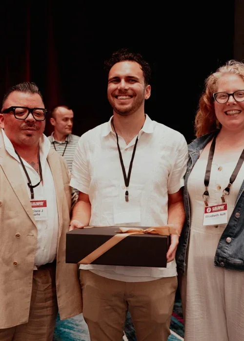 Alejandro Comas-Short (representative for 2025 winner Ann Ngoc Tran, center) with prize announcers Frank Galarte (left) and Elizabeth Ault (right) at the 2025 ASA conference.