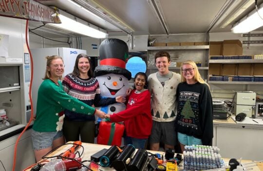 students with snowman-christmas
