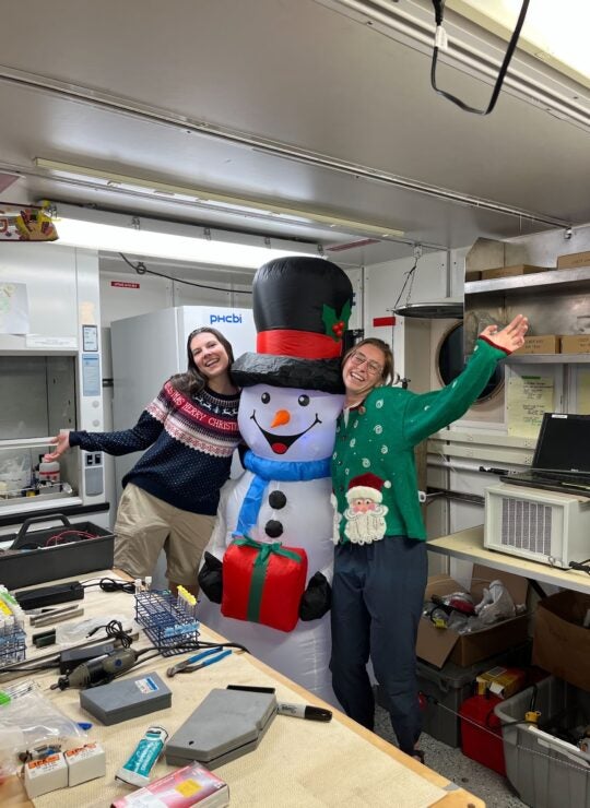 two students with snowman