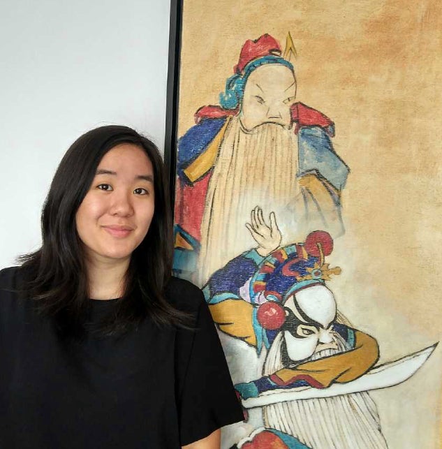 Headshot of Kimberly Cheng in front of a Chinese painting.