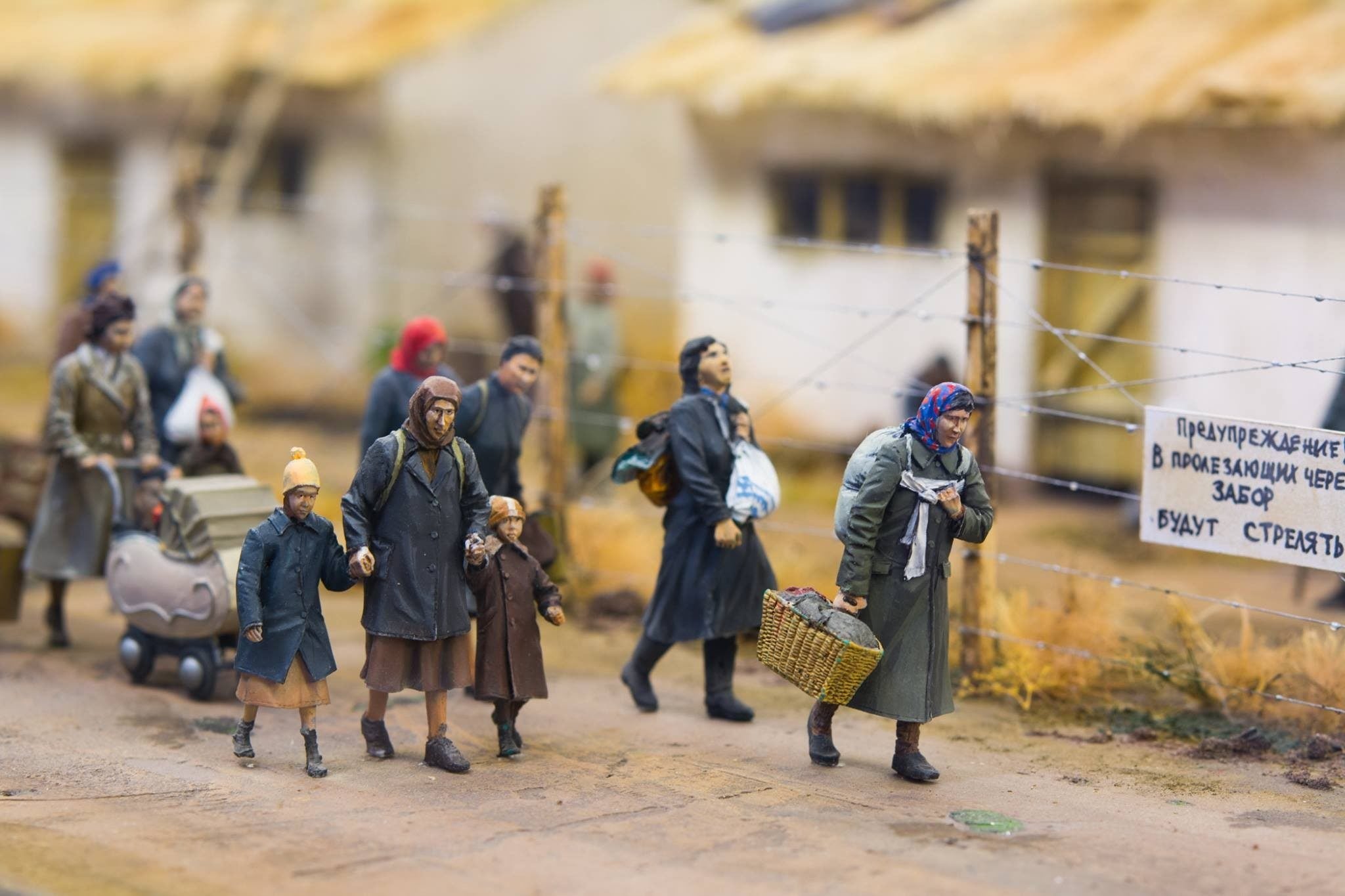 A mini-diorama titled, "Ghetto in Transnistria" depicting women and children tiredly walking through a ghetto. Created by Evgeny Kapuka from the Odessa Holocaust Museum collection. (Photo by Nikolai Gorshkov)