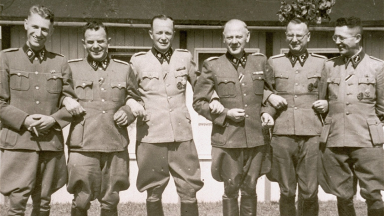 Commandant Franz Ziereis poses with members of the SS staff of the Mauthausen concentration camp. Photo from the United States Holocaust Memorial Museum, courtesy of Eugene S. Cohen.