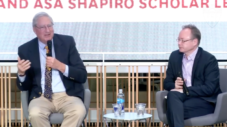 Screenshot of Christopher R. Browning, left, and Wolf Gruner, right, sitting during a lecture Q&A.