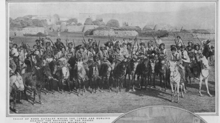 A black and white portion of the The New York Times, issue Sunday, January 24th, 1915. It depicts a group of men on horses. A caption reads, “Troop of Kurd cavalry which the Turks are hurling against the Russians in the passes of the Caucasus Mountains.”