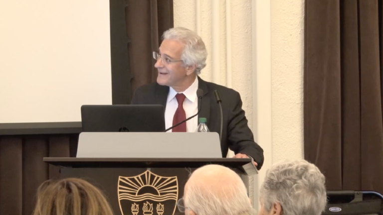 Screenshot of Omer Bartov looking to the left, smiling, during his lecture.