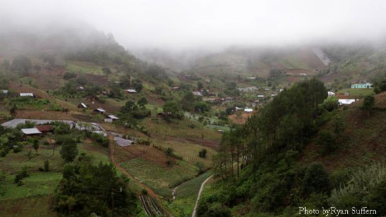 A landscape photo of Pambach village, at Santa Cruz Verapaz township, in Alta Verapaz department, Guatemala, taken June 2, 2014. This was the site where 82 people vanished in 1982. The photo is labeled, 
