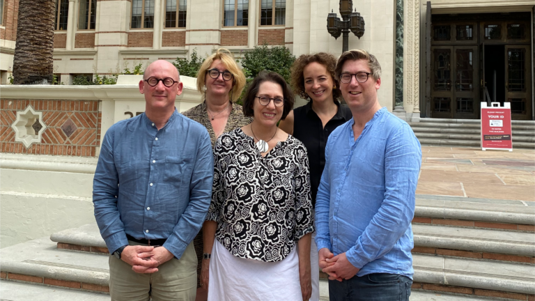 The Third Interdisciplinary Research Week Team pose in front of Doheny Library. From left to right: Jean-Marc Dreyfus, Elisabeth Anstett, Michaela Haibl, Anne-Berenike Rothstein, and Seán Williams.