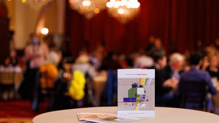 Table setup featuring the CESR brochure at CESR's 10 Year Anniversary Conference at USC's Town & Gown.