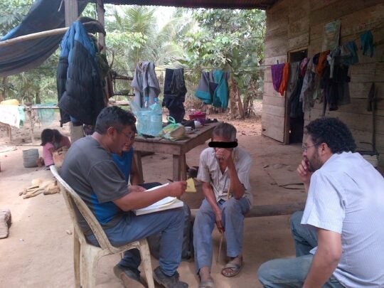 Participant being surveyed by a group for the Tsimane project.