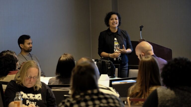 Shailly Gupta Barnes speaks in front of podium