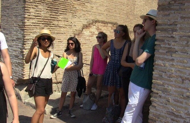 Students learning about the Colosseum in Rome.