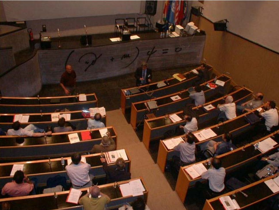 Photo of people sitting in a conference hall