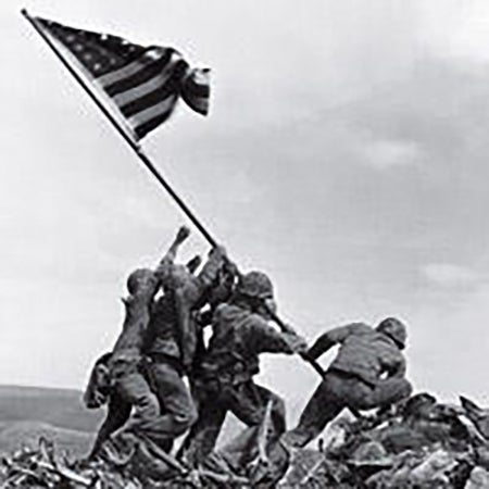 Pultizer Prize-winning photograph of U.S. Marines raising the American flag atop Mount Suribachi in Iwo Jima, Japan, in 1945. Joe Rosenthal took this photo.