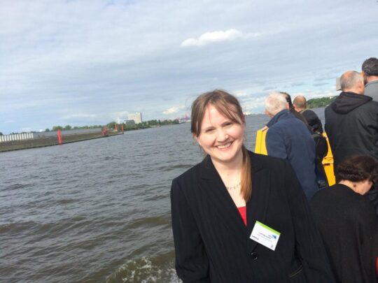 A photo of Whitney Matthews on a boat while on a business trip to Germany.
