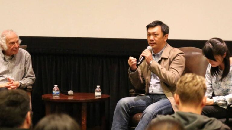 The Great Buddha+ Director, HUANG Hsin-yao, answering questions on stage with Prof. Stan Rosen and an interpreter after the screening.
