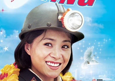 A woman with a miner helmet