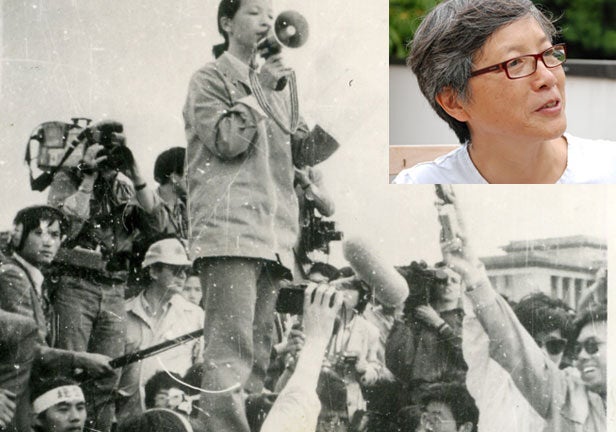 A vintage photo of a woman speaking through a megaphone. People in the crowd below are pointing microphones and cameras at her. In the top right is a colored photo of a woman.