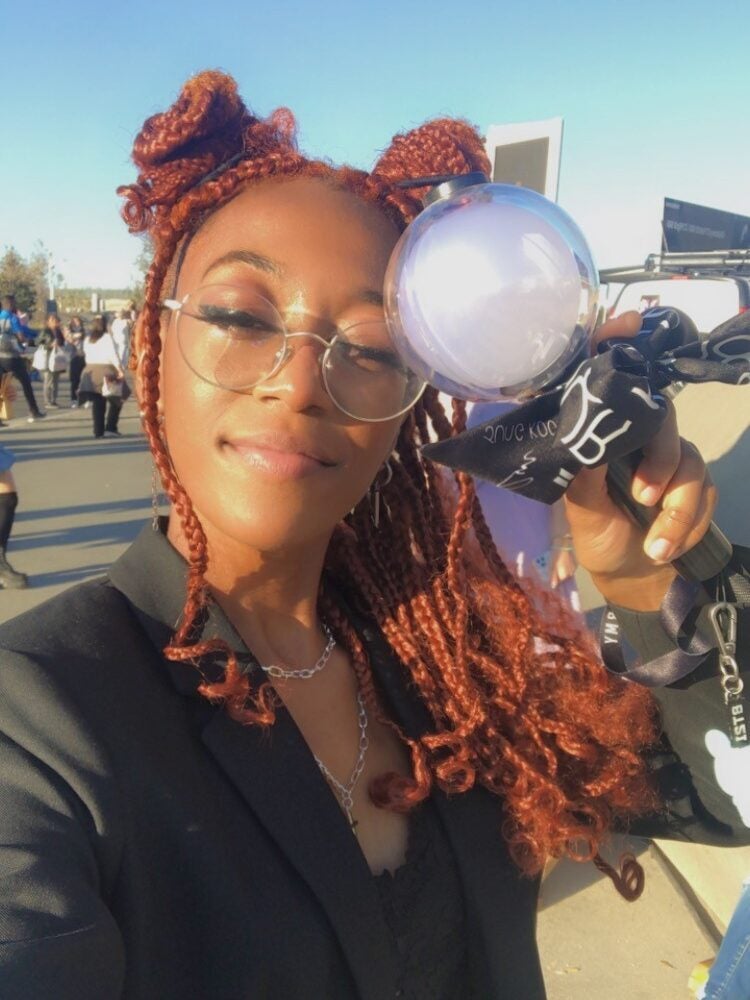 Dionee with a BTS lightstick