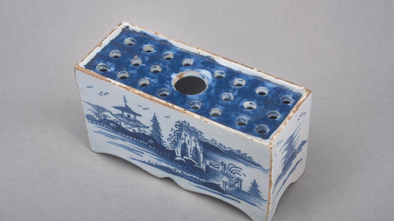 Rectangular ceramic brick with holes in top surface for inserting/holding flowers