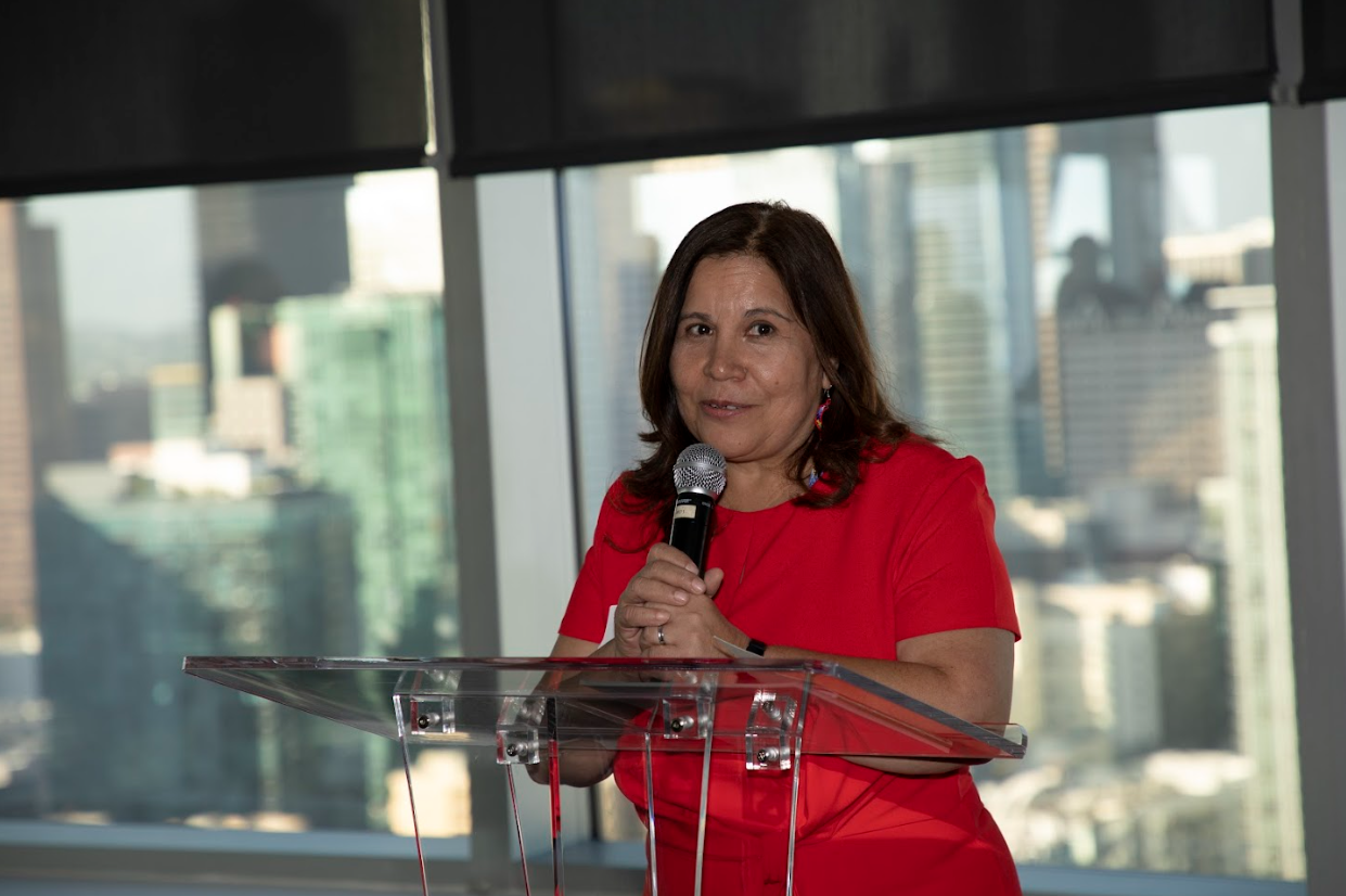 Angelica Salas speaking at the podium at ERI's 15th Anniversary Party in Downtown LA