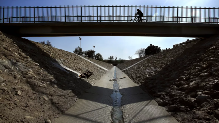 The greening of the concrete-lined Pacoima wash, pictured in 2014, is part of the effort to turn down rising temperatures that disproportionately affect Black and Latino neighborhoods and lower income communities. (Mel Melcon / Los Angeles Times)