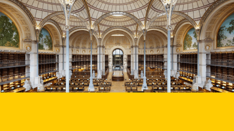 The study room of a 19th-century library, with volt ceiling and books on the walls.