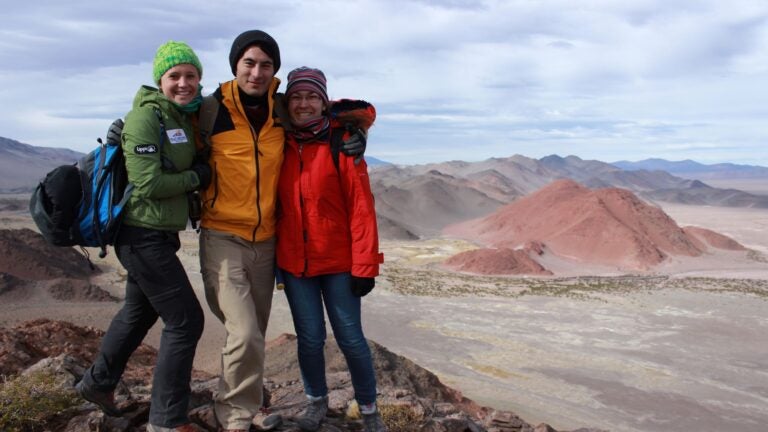 Photo of students studying overseas with mountains in the background.