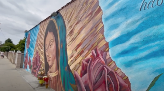 A photo of a mural depicting Our Lady of Guadalupe.