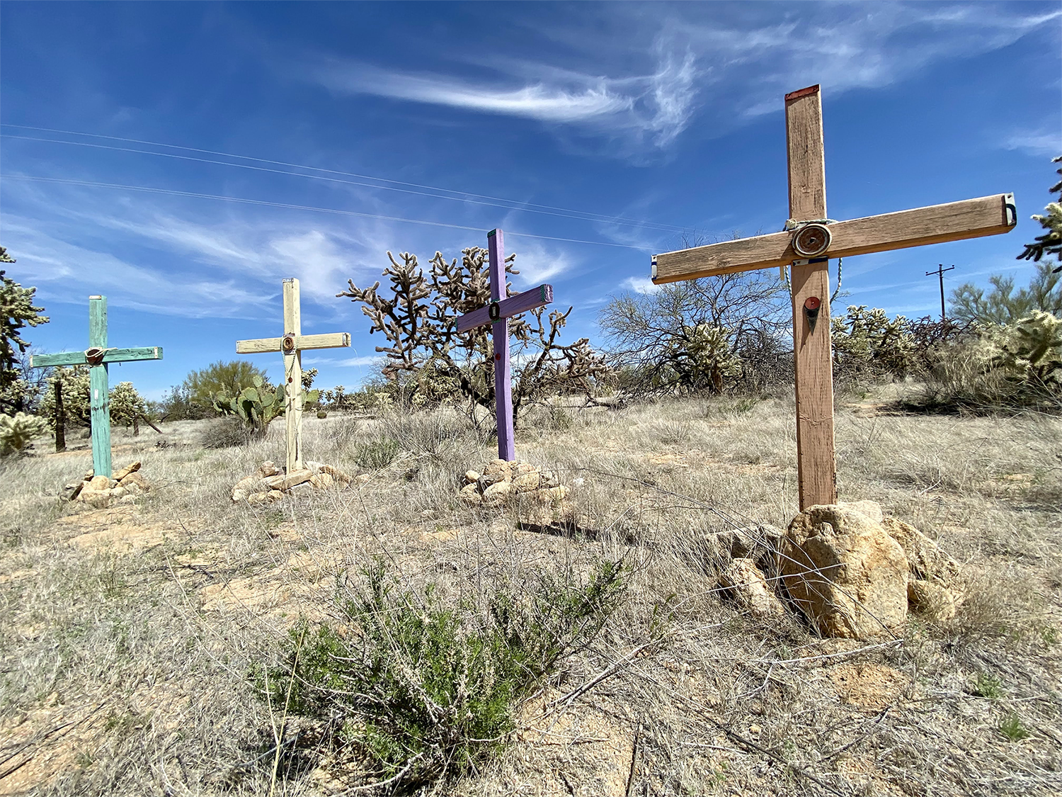 A photo of wooden crosses in the desert near the U.S.-Mexico border honoring migrants who have died. 