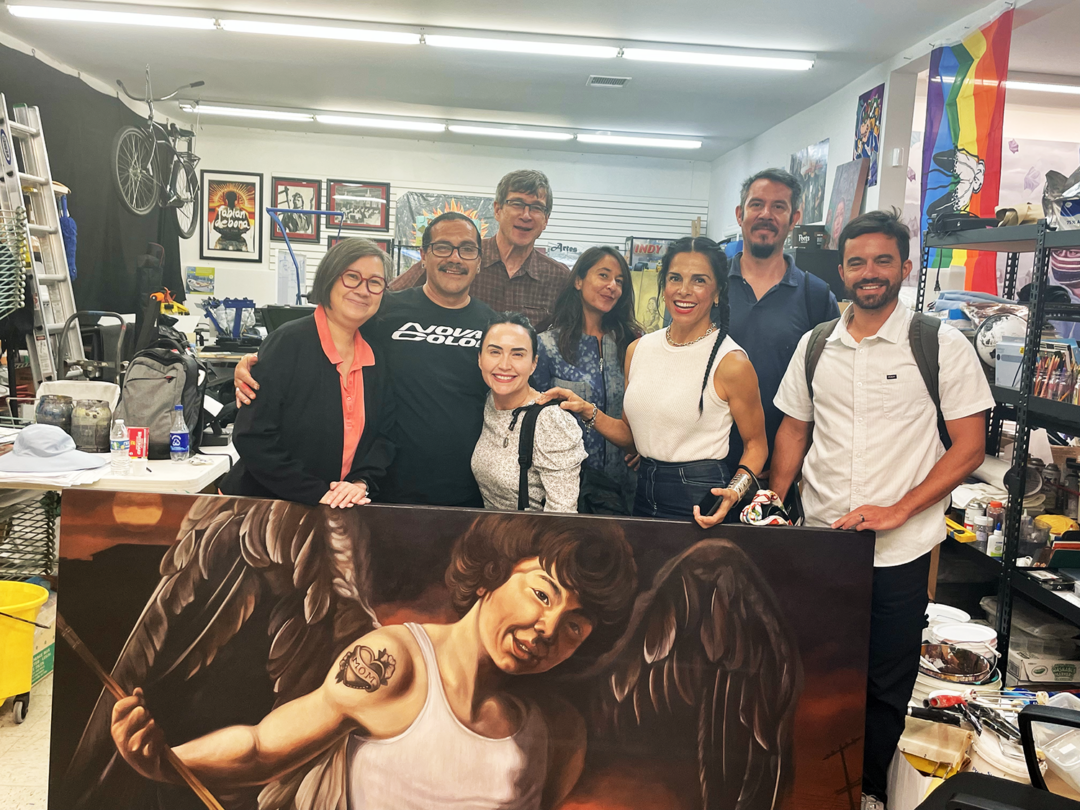 USC faculty and staff in the art studio of muralist Fabian Debora