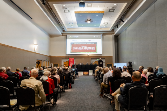 A photo of people attending an indoor lecture