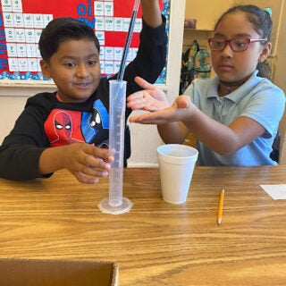 Elementary students experimenting with different instruments