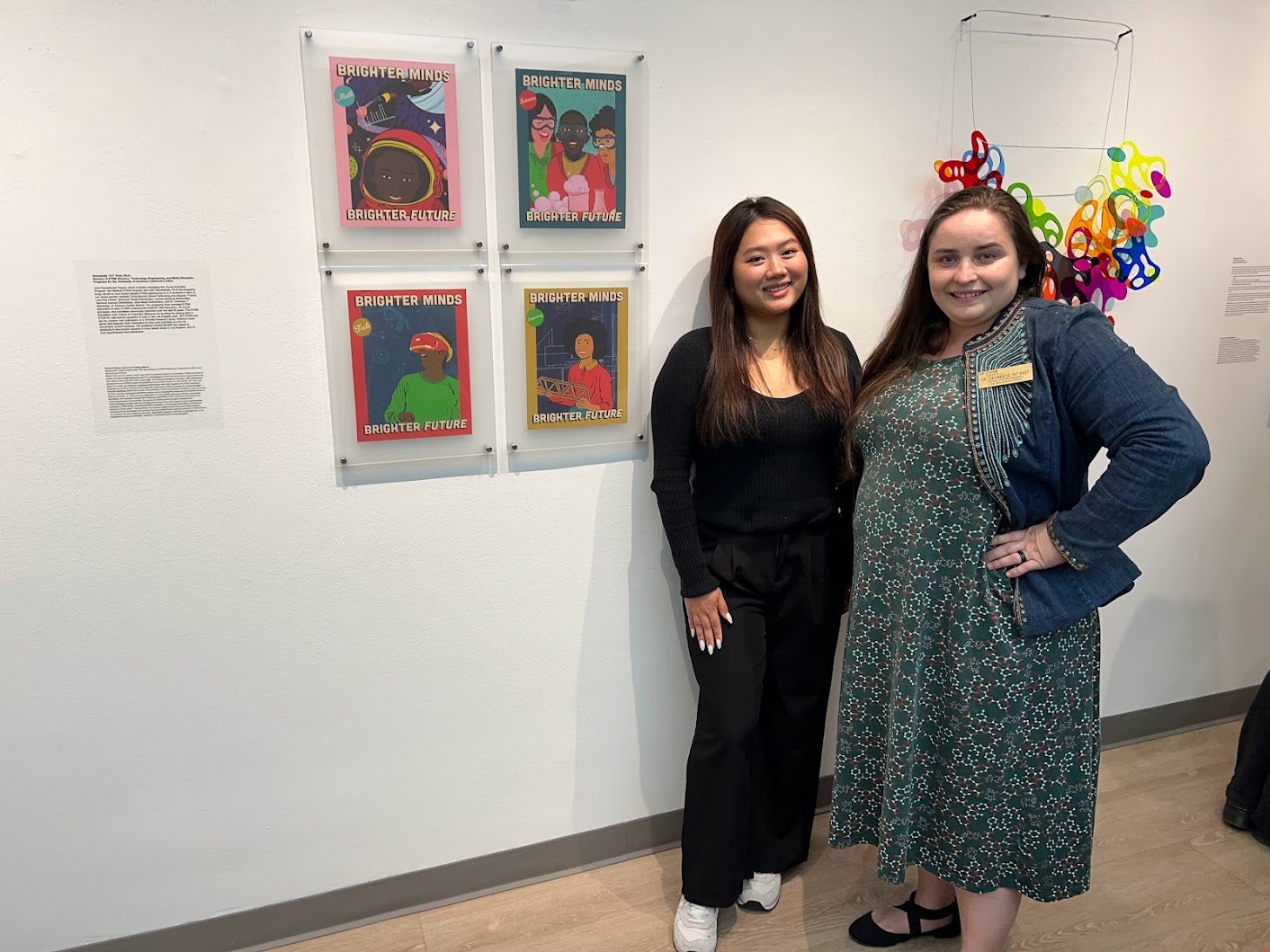 Artist Chloe Barker and Dr. Dieuwertje "DJ" Kast in front of the beautiful artwork created inspired by JEP's STEM Education Programs