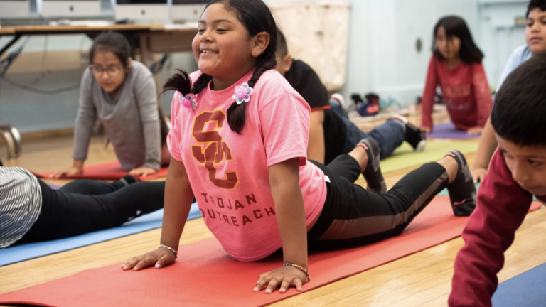 Child doing Yoga Pose