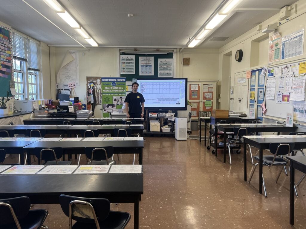 Varun standing at the front of the class