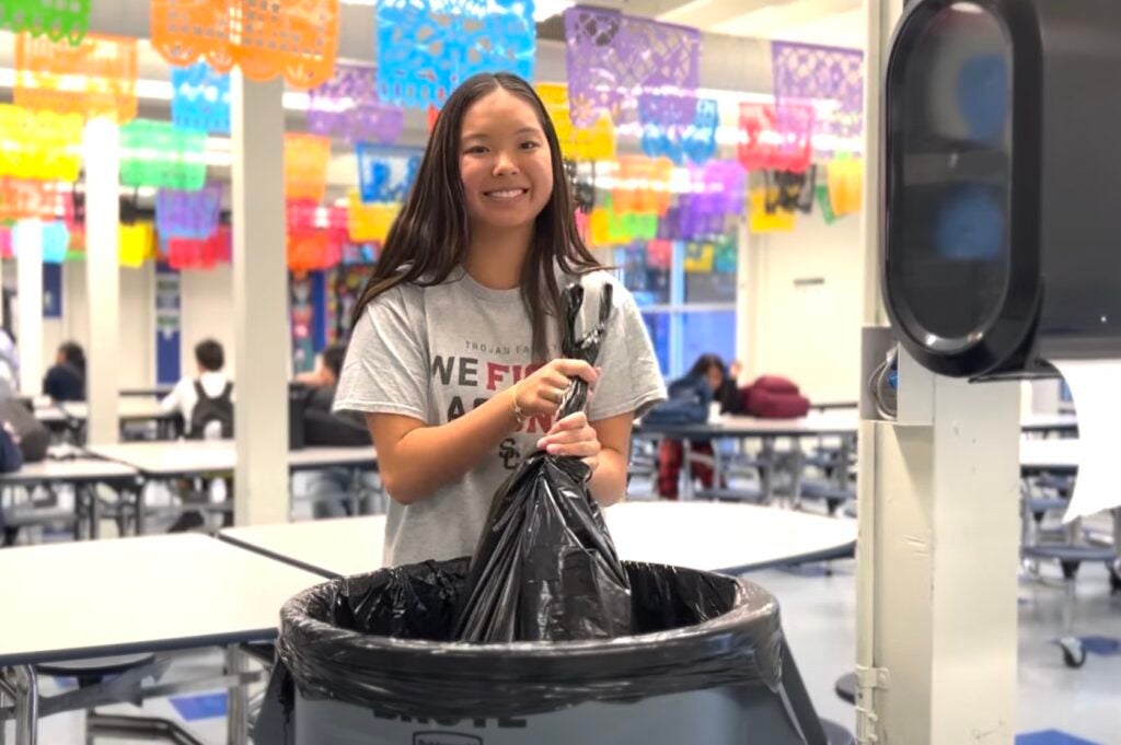 Siena helps with clean up