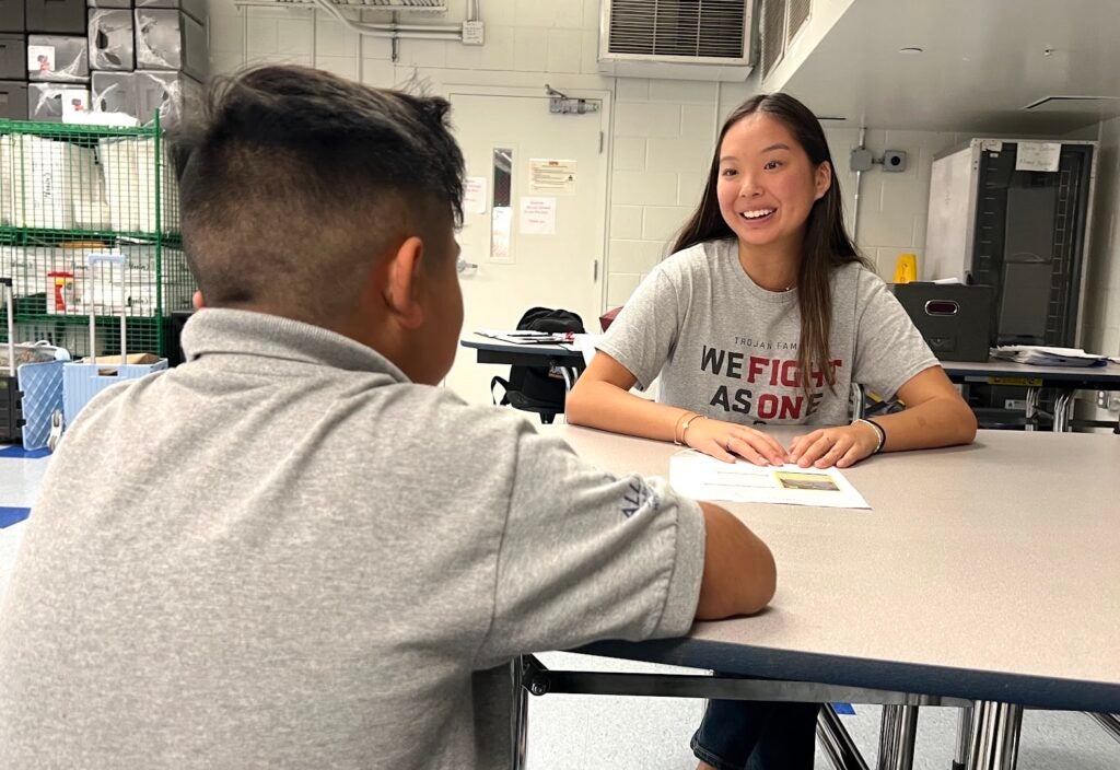 Siena helping the students with their homework