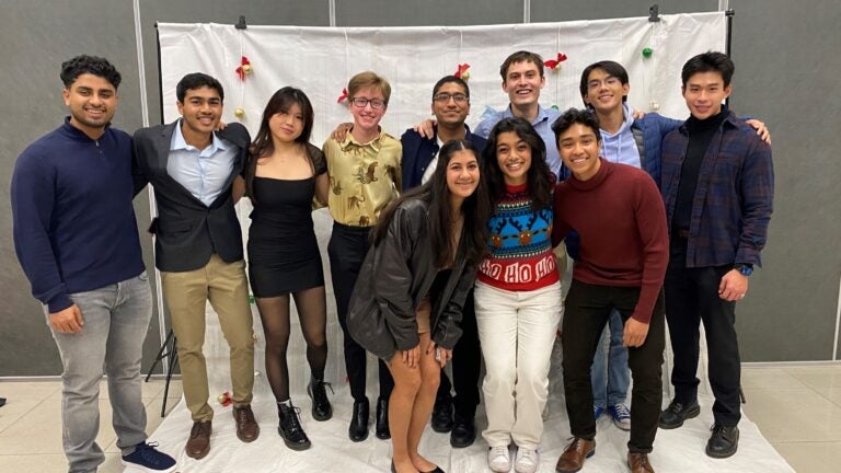 students posing at a holiday party