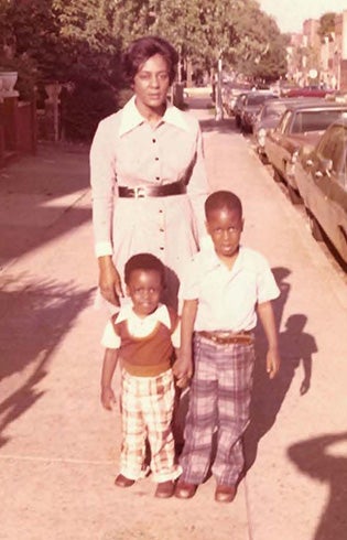 A faded photo of a woman and two children.