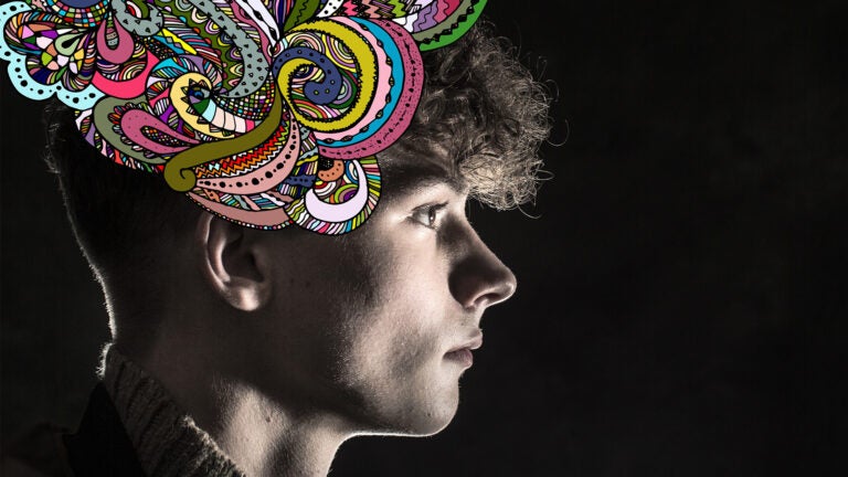 Abstract image of teen boy with colorful designs emerging from his head