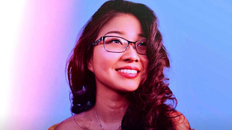 Headshot of Chen against a fluorescent background