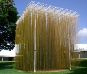 Jesús Rafael Soto’s sculpture "Penetrable," an outdoor installation with hanging pieces of yellow material.
