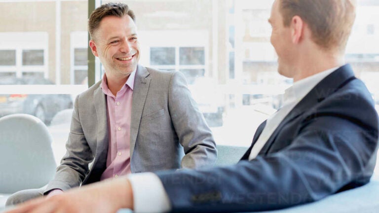 Two businessmen having discussion at office meeting
