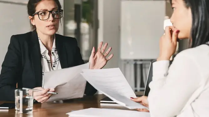 2 women discussing something