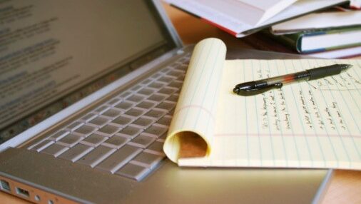 Photo of paper and laptop