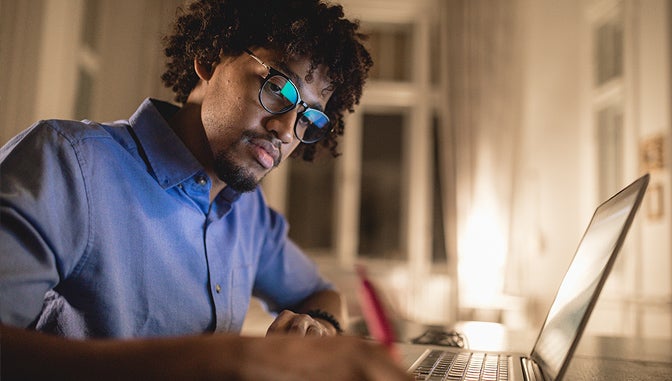 Male student writing