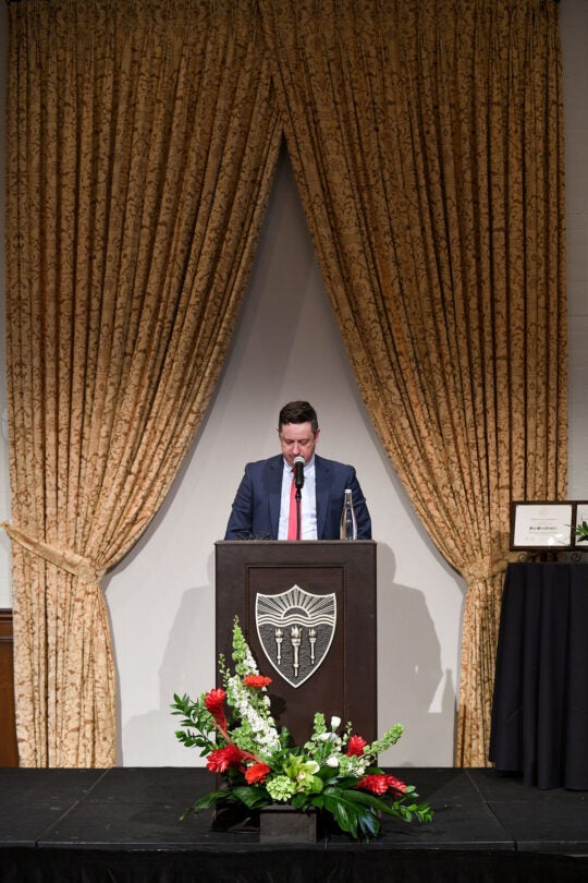 Executive Board Member, 2022 Phi Beta Kappa President, Andrew Stott, at podium.
