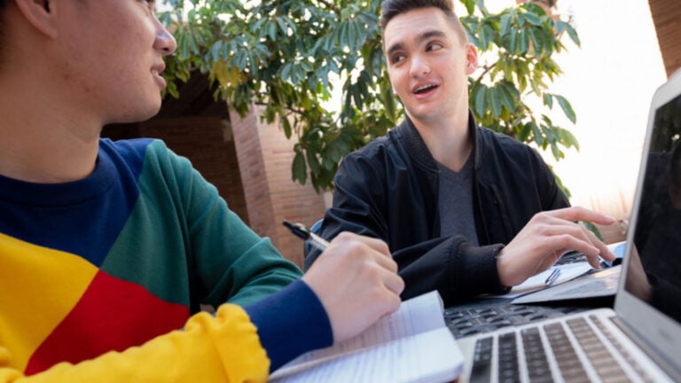 Two male students conversing