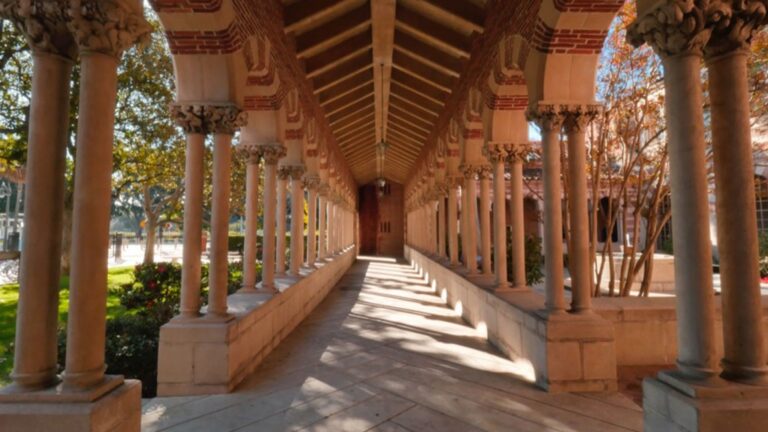 An image of a hallway with arches and columns on the North part of the University Park Campus.
