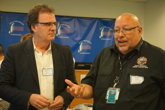 Climate Resolve's Jonathan Parfrey and Long Beach Emergency Manager David Ashman work together during an exercise.